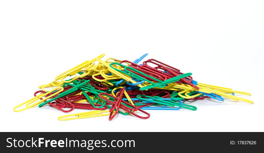 Close-up of multi-colored paper clips isolated on a white background