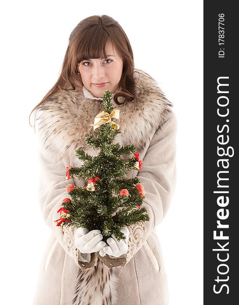 Girl in fur coat with Christmas tree