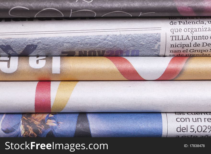 Several folded newspapers and texture background. Several folded newspapers and texture background
