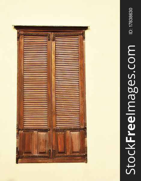 A view of an antique wooden window. A view of an antique wooden window