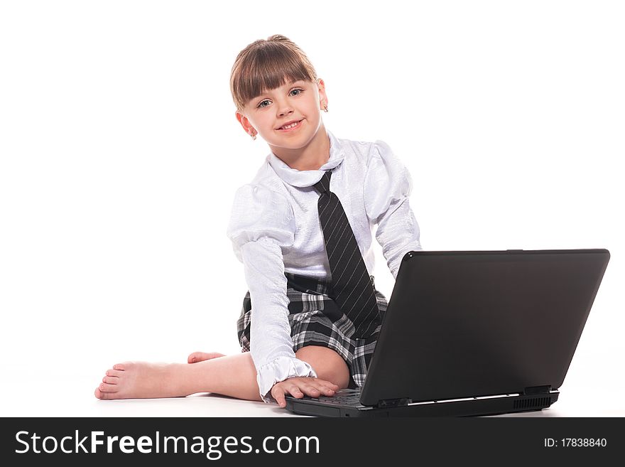 Attractive little girl with laptop isolated