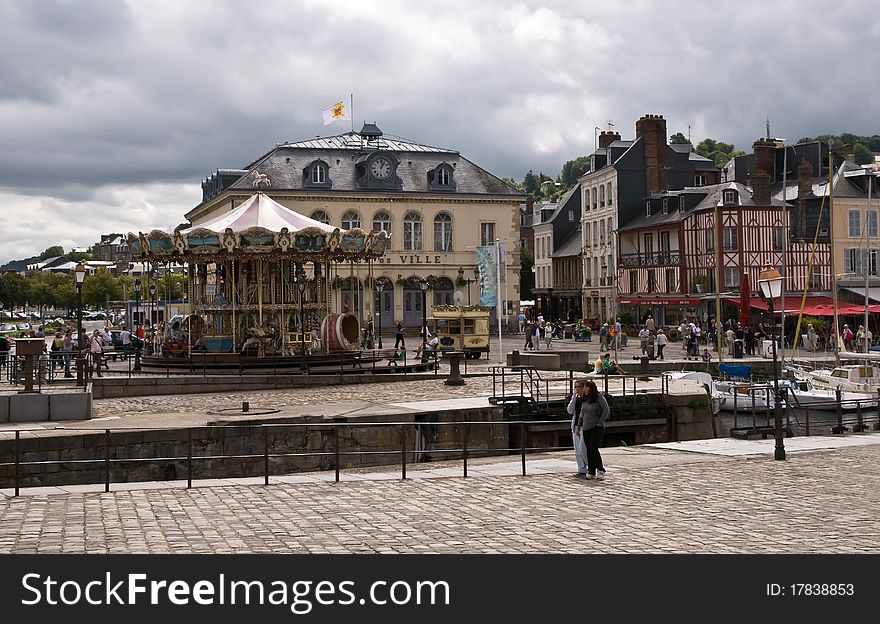 City buildings and carousel of the  Honfleur. Normandy. City buildings and carousel of the  Honfleur. Normandy