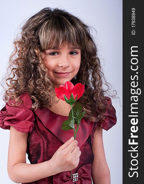 Beautiful Little Girl With Red Rose