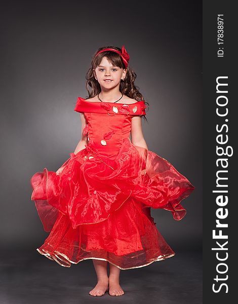 Beautiful little princess dancing in luxury dress