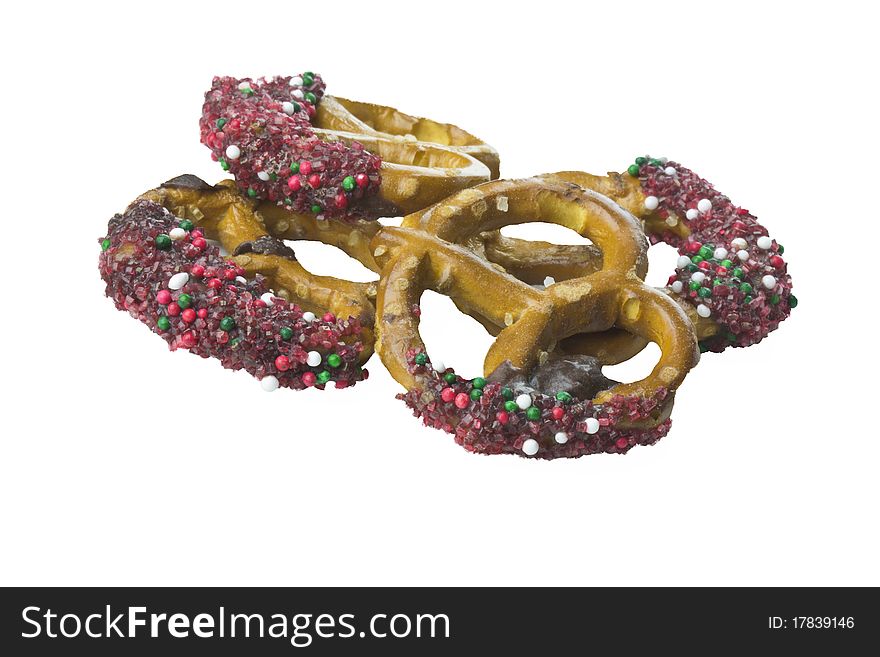 Homemade candy coated pretzels isolated over white. Homemade candy coated pretzels isolated over white