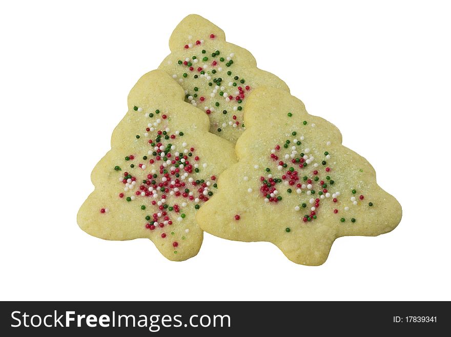 Three christmas tree cookies piled together and isolated on white background