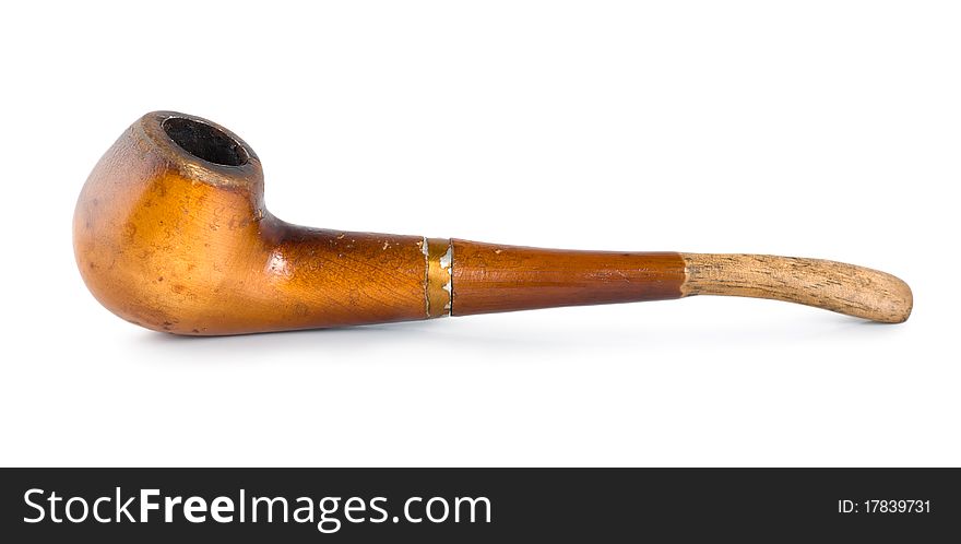 The old smoking pipe isolated on white background