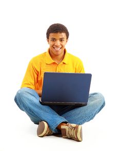 Happy Young Man Working On A Laptop Stock Images Happy Young Man Working On A Laptop Stock Images
