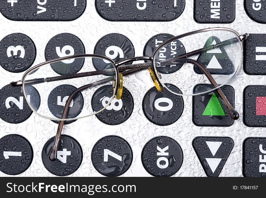 Glasses and Remote control numer keypad with buttons. Glasses and Remote control numer keypad with buttons