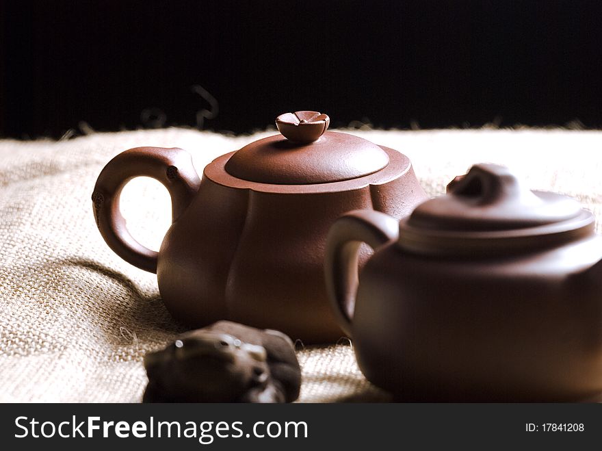 Chinese teapots with canvas background.