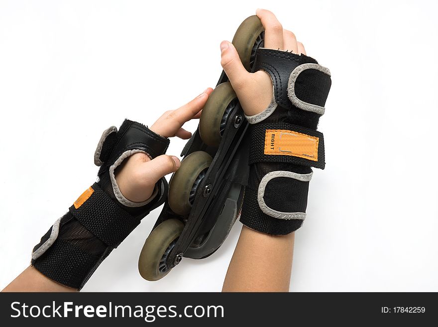 Hand, with roller skates on white background. Hand, with roller skates on white background