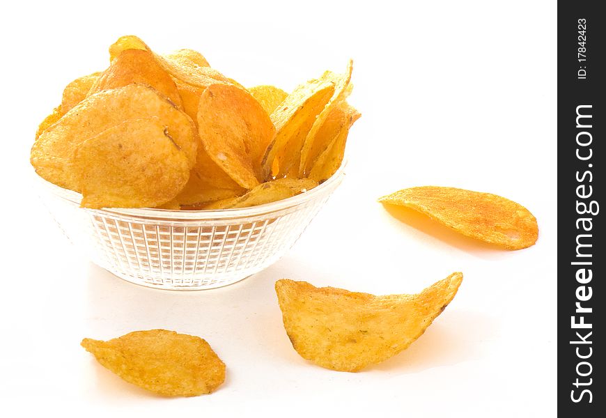 Potato chips in a glass bowl isolated on white background