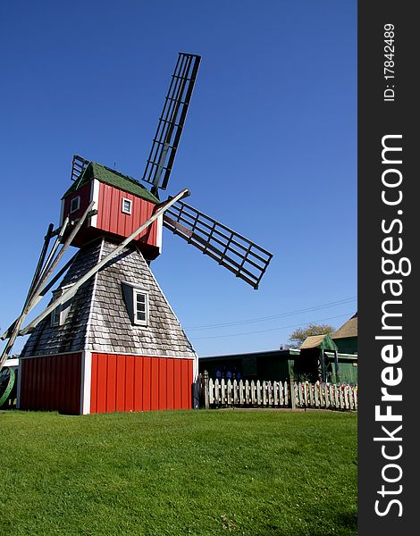 Old dutch wind mill against blue sky. Old dutch wind mill against blue sky