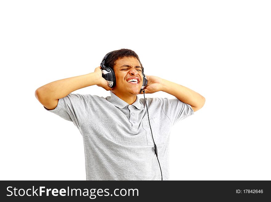 Young happy man listening to music