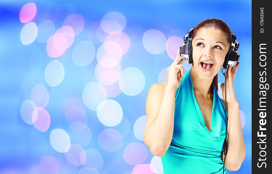 Happy beautiful woman listening to music