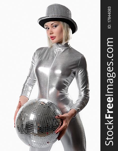 Beautiful young woman with a disco ball isolated on white
