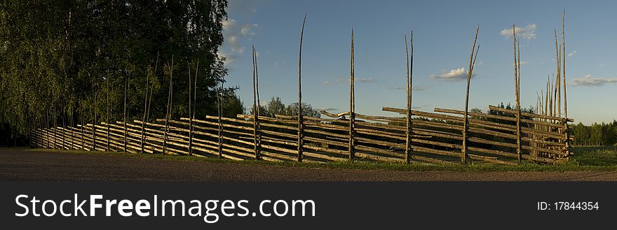 Old swedish wooden fence in the sunset. Old swedish wooden fence in the sunset