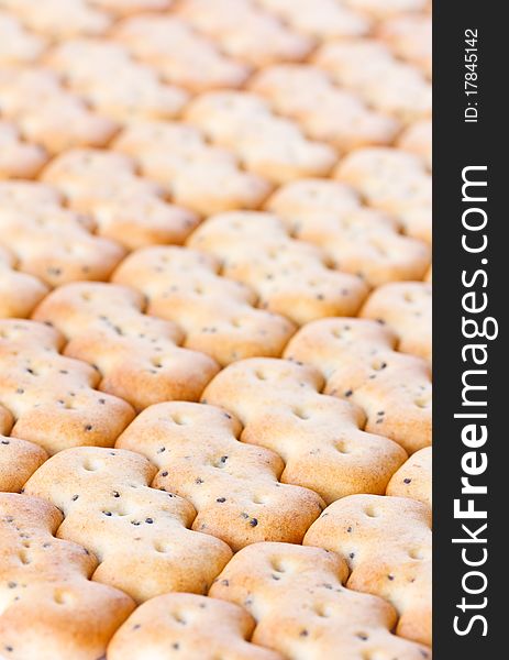 Small shaped browned crisp biscuits as tile background