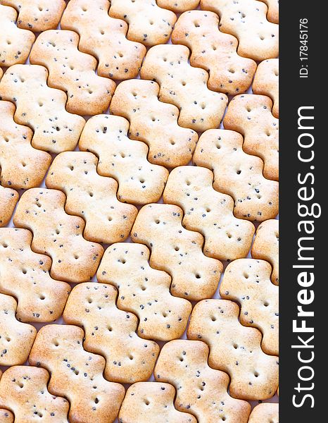 Shaped Browned Crisp Biscuits As Tile Background