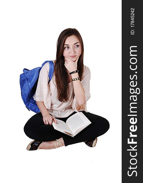 An teenager sitting on the floor with a blue backpack over her shoulder
in a blouse and black tights, with a book on her lap, for white background. An teenager sitting on the floor with a blue backpack over her shoulder
in a blouse and black tights, with a book on her lap, for white background.