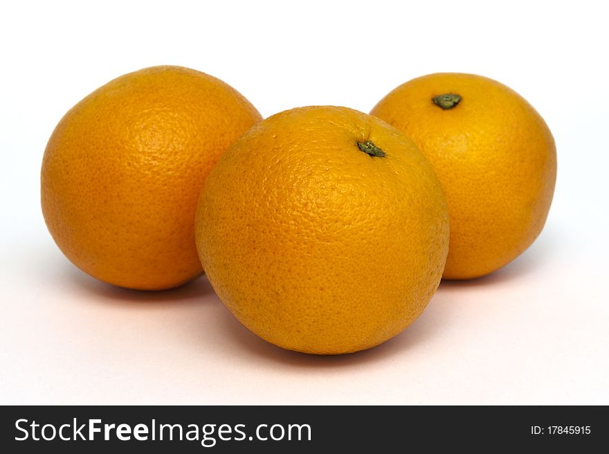 Three oranges isolated on white