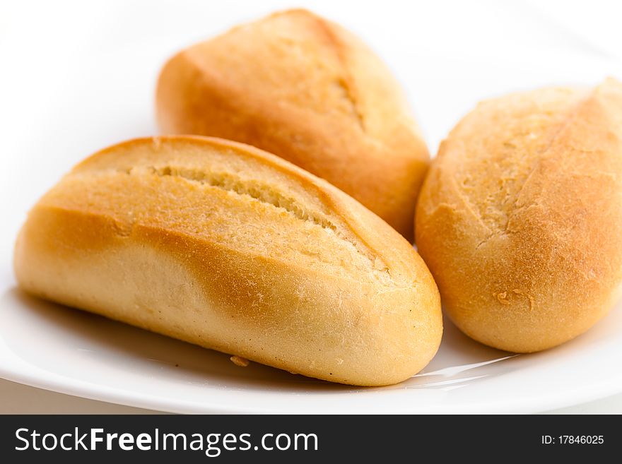 Appetizing soft delicious three rolls on a dish. Appetizing soft delicious three rolls on a dish