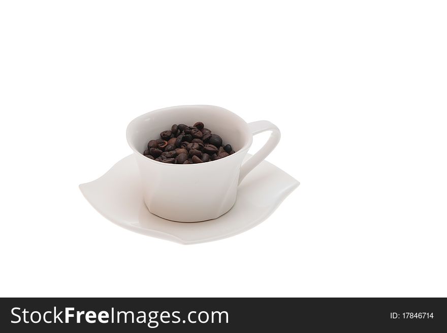 Cup of coffe beans on white background