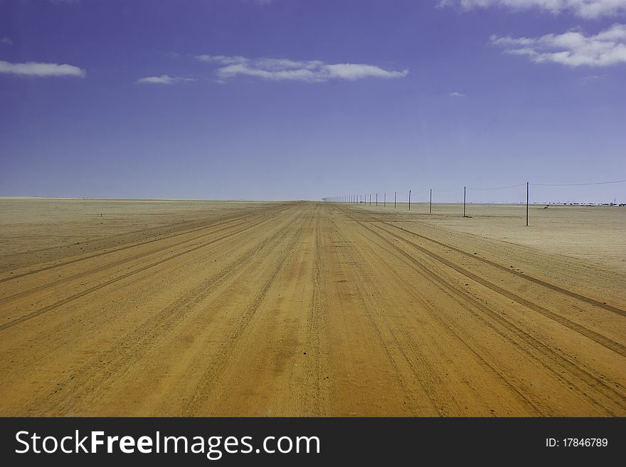 Empty road in Namibia, sky with clouds, you can place whatever you want on it