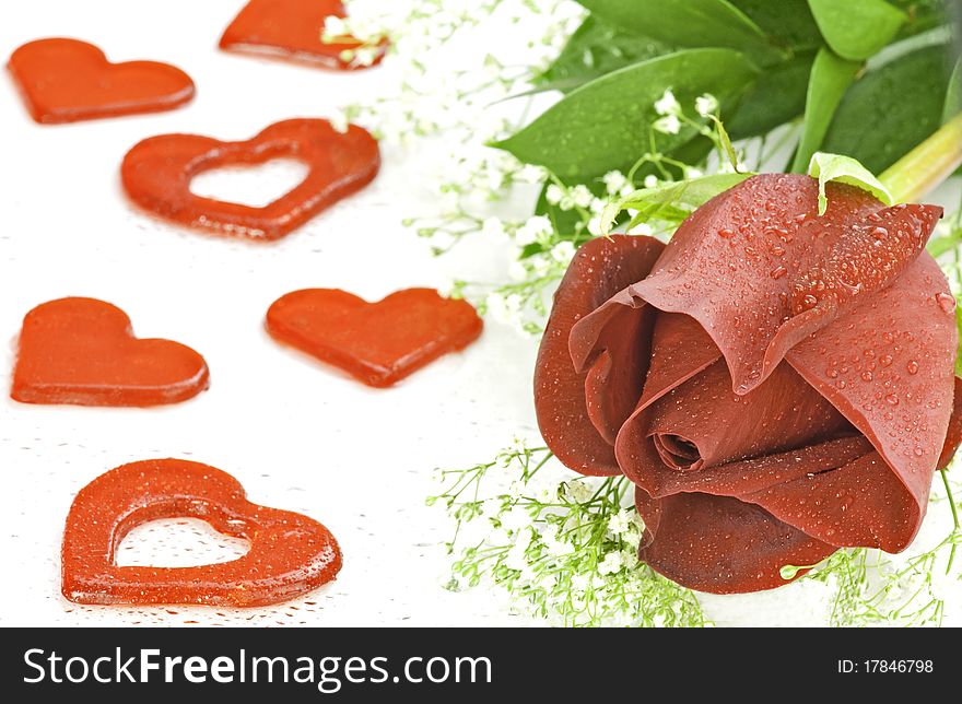 A rose and hearts representing a gift of love. A rose and hearts representing a gift of love