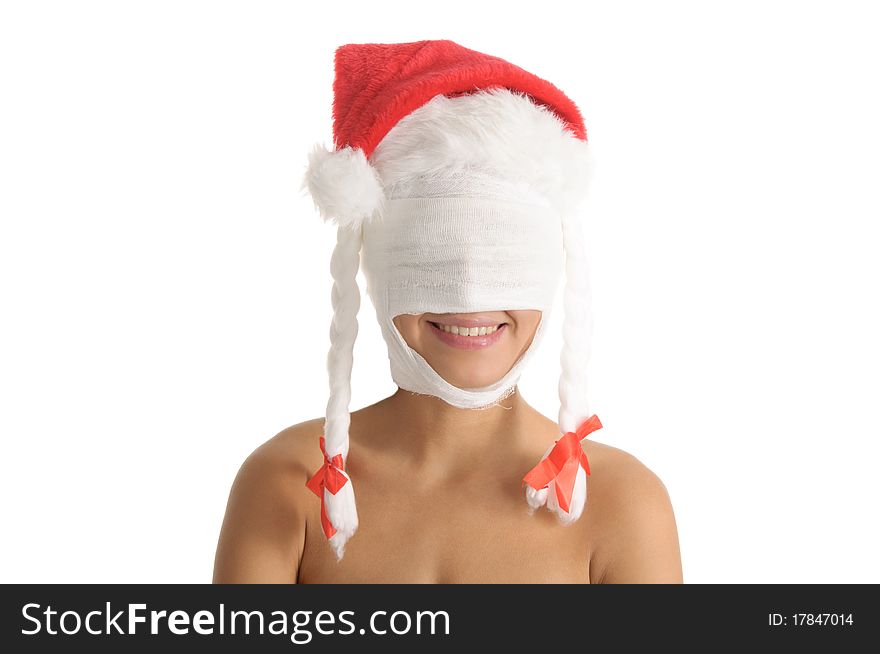 Young woman with bandaged head in Christmas cap isolated in white