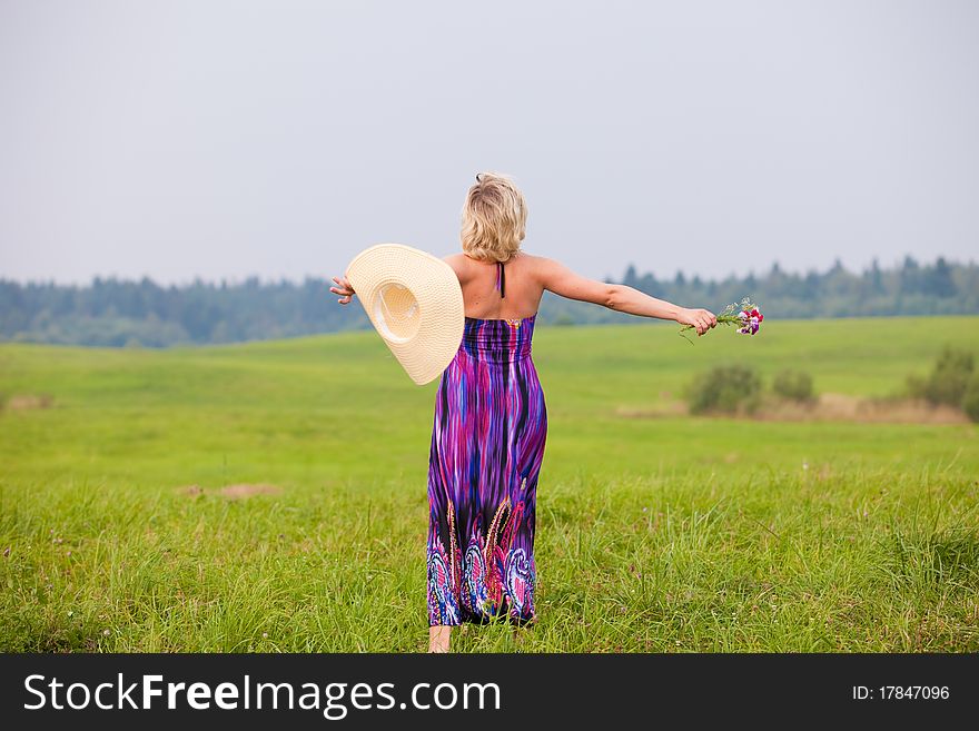 The young beautiful girl on a meadow