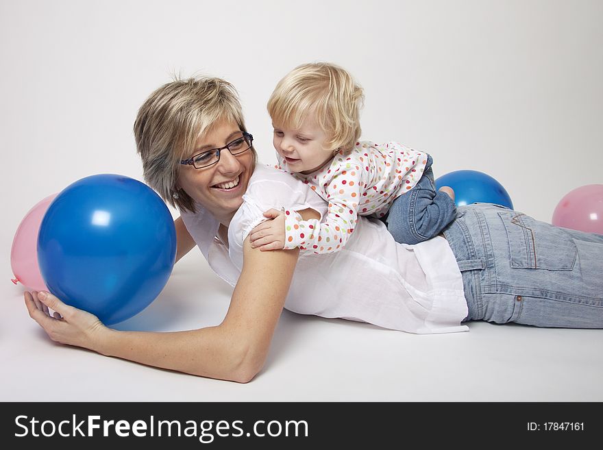 Mother And Daughter Portrait With Balloons