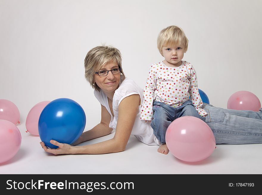 Mother And Daughter Portrait With Balloons