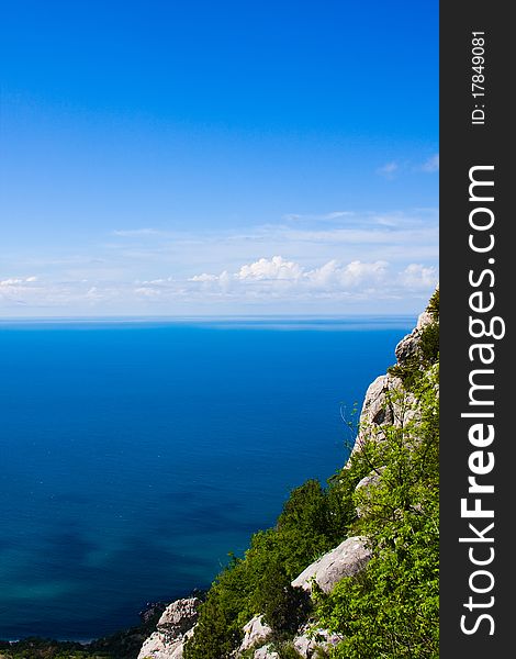 The blue sky with clouds, the sea and mountain. The blue sky with clouds, the sea and mountain