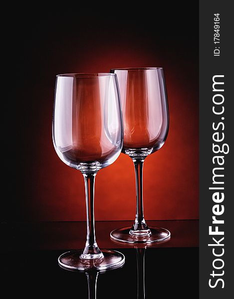 Glasses on a dark red background