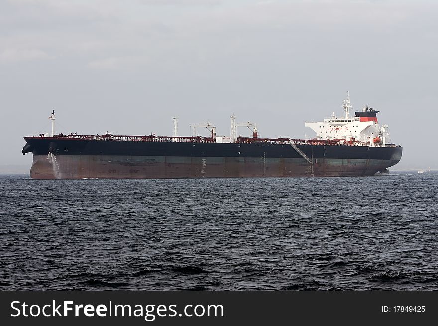 Oil super tanker under power at sea.