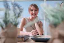 Young Business Woman Sitting At Office Desk Royalty Free Stock Photo