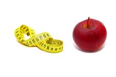 Measuring Tape With Red Apple Royalty Free Stock Images