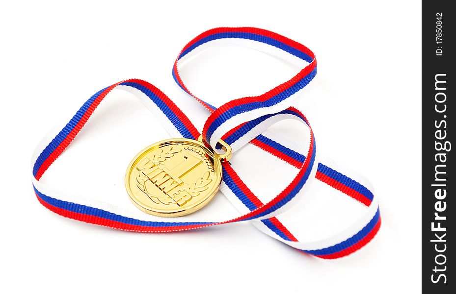 Golden medal and ribbon isolated on white background