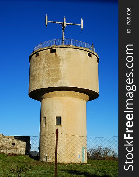 A tower for water supply with blue sky. A tower for water supply with blue sky