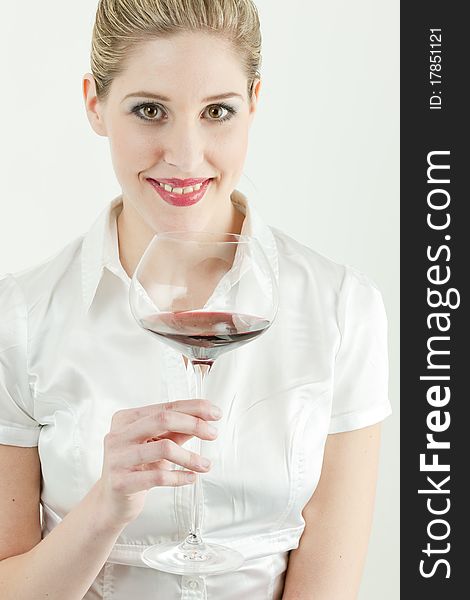 Portrait of young woman with a glass of red wine. Portrait of young woman with a glass of red wine