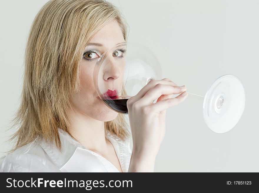 Portrait of young woman drinking red wine