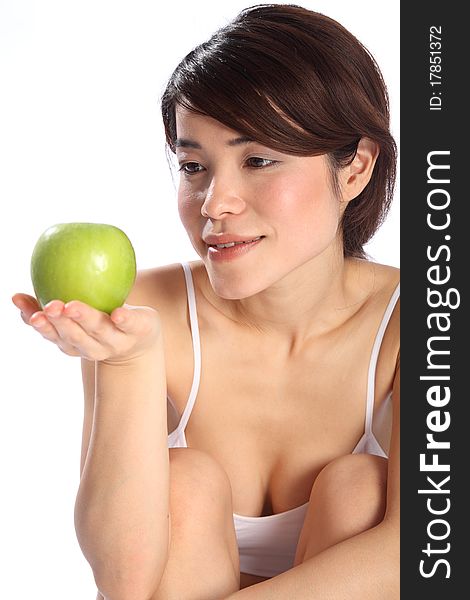 Beautiful Japanese girl holding green apple fruit