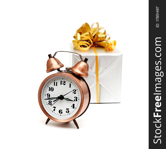 A retro clock with presents isolated on white bacground