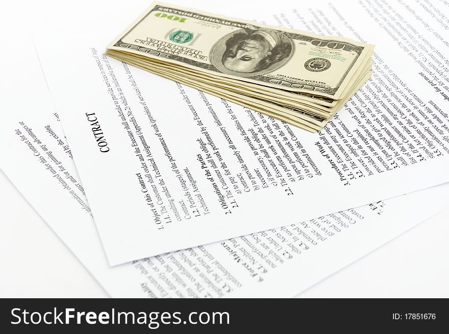 Stack hundreds dollars on contract Document background