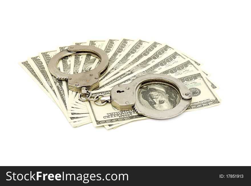 Handcuffs on money background