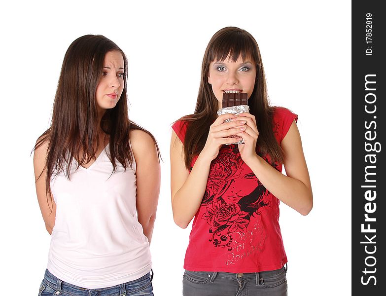 Two girls with chocolate. Isolated at white background