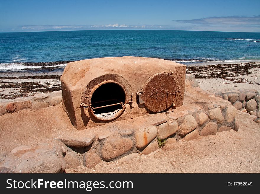 Old fashioned clay outdoor oven at the seaside for baking bread with a wood fire