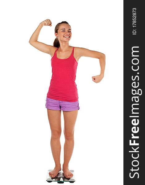 Young woman tense muscles on scale