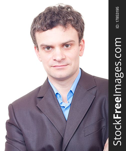 Portrait of young businessman in suit against white background